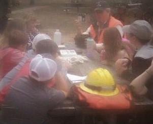 Students and presenter gathered at the safety in the woods station at the Eco Day at the Piney Wood Rec Area